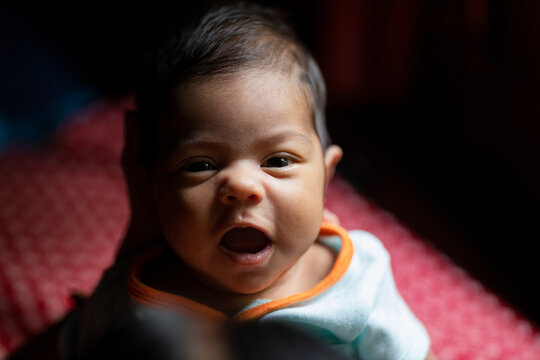 Portrait of newborn baby smiling
