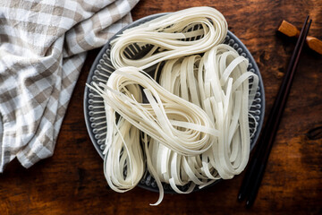 Dried white rice noodles. Raw pasta. Uncooked noodles.