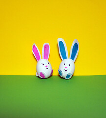 Easter bunnies from an egg on a yellow background.