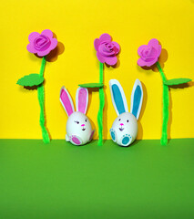 Easter bunnies from an egg on a yellow background.