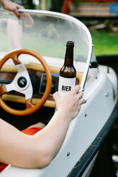 Close Up Of Female Hand Holding A Beer Bottle