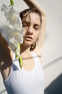 Young woman with white flowers