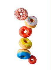 Various decorated doughnuts flying levitation