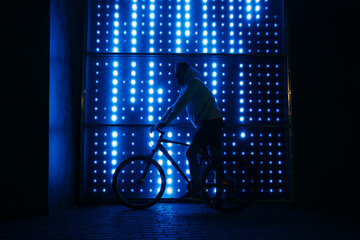 Man on bicycle at night