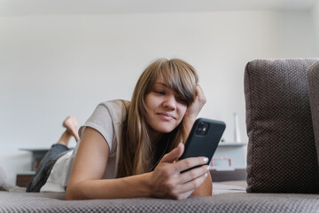 Woman With Cellphone At Home