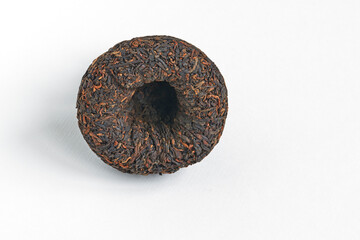Chinese pressed pu er tea on white background close-up