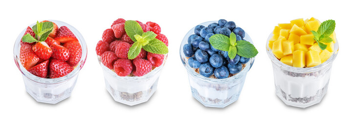 Set of Greek yogurt granola parfaits with strawberries, blueberries, mango fruits and raspberries in a glass on a white isolated background