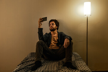 sitting in bed with cellphone