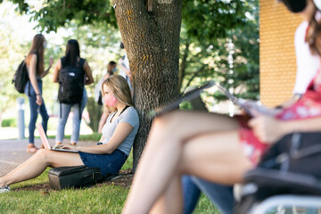 Covid: Student Sits Against Tree Taking Virtual Class