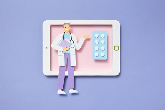 Papercraft doctor on a tablet screen with meds.