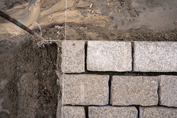 Laying gray paving stones