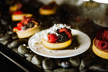 modern sweet dessert with frozen ingredients and fruits 
