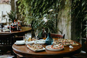 celebration table decoration with flowers candles fruits at the restaurant