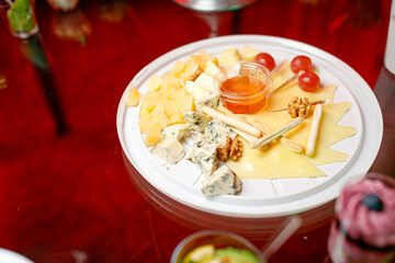 buffet table with toasts and snacks and desserts and cheese plate