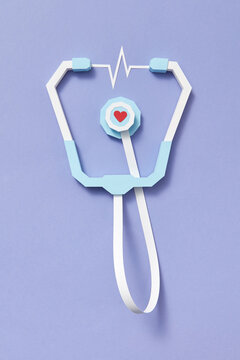 Handmade papercraft stethoscope with heartbeat.
