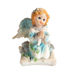 angel statue isolated on white background. Figurine of an angel on a white background. Ceramic angel isolated.
