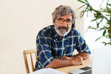 Portrait of a senior employee looking at camera