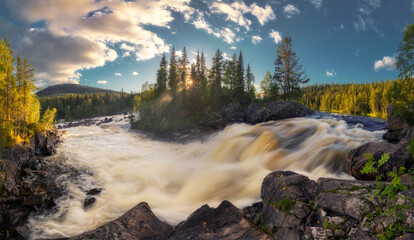 Landscape with a waterfall and backlit sunset light