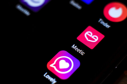 Dating app icons on black screen