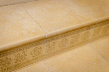 The floors are yellow marble slabs.