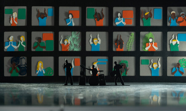 Music band's silhouette in front of mega screen