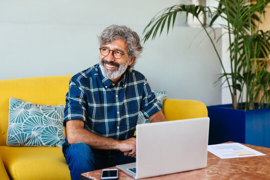 Cheerful Man Working In A Modern Space