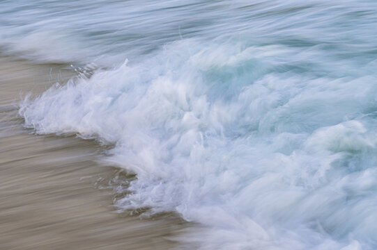 Waves Rolling And Crashing Onto Shore