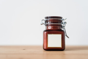 Scented candle in a glass jar on a white background
