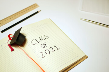 Class of 2021 written in notebook. Graduation concept. Education stationery 