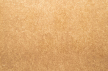 Vintage aged worn brown paper texture background with copy space 