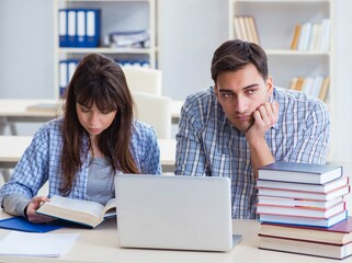 Students sitting and studying in classroom college