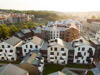 Obraz premium Aerial view of residential area in Vilnius, Lithuania. New modern apartment complex. Low rise european apartment building complex.
