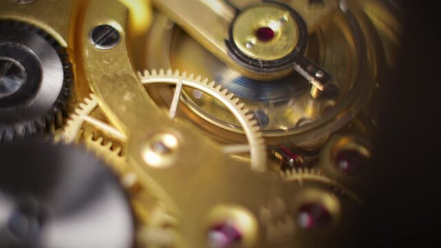working clockwork gears (clock mechanism) inside a vintage clock