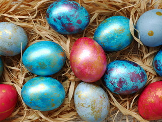 Easter flatlay with beautiful painted eggs. Concept of Easter egg hunt or egg decorating art