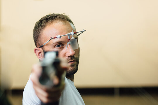 Young Sportsman Practising Rifle Shooting
