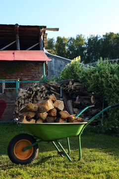 Wheel cart with logs in yard