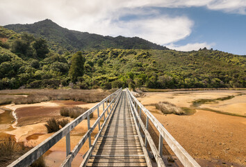 wooden footbridge at the beginning of Abel Tasman Coast Track in Abel Tasman National Park, South Island, New Zealand
