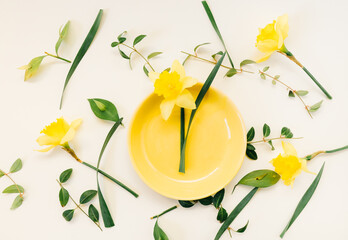 Creative spring concept ideas  made of fresh  yellow  flowers and pastel plate bowl  decoration isolated on white background .Flat lay - 420595459