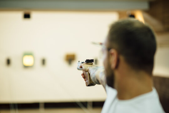 Man Practising Rifle Shooting