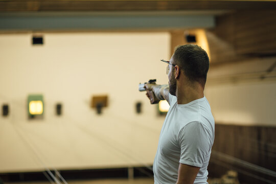 Man Practising Rifle Shooting