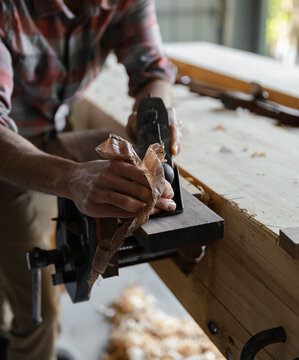 carpenter planing wood