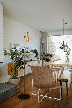 Clean interior with design chair and messing floor lamp