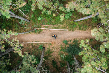 Young man running through the forest
