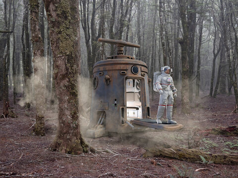 Astronaut disembarks from re-entry capsule in forest