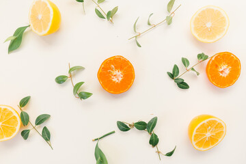 Creative composition made of  citrus fruits  lemon , orange with green leaf  colors on white background, flat lay - 420597223