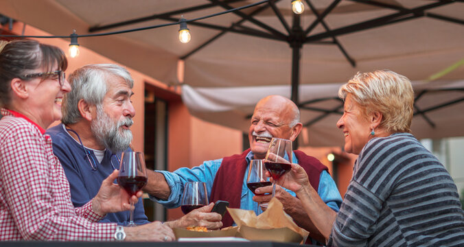 Group Of Old People Eating And Drinking Outdoor