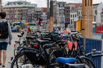 Fototapeta na wymiar Row of bicycles parked on the sidewalk in European street