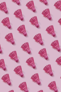 Pink colored plastic shuttlecocks pattern.