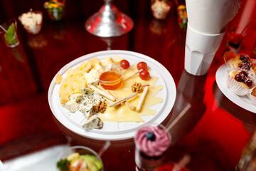 buffet table with toasts and snacks and desserts and cheese plate