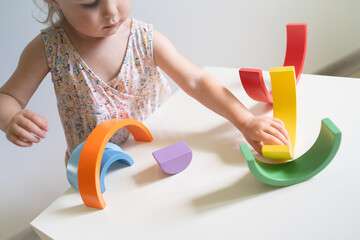 Toddler playing with colorful toys